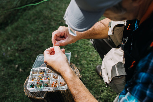 Person handling a fishing lure