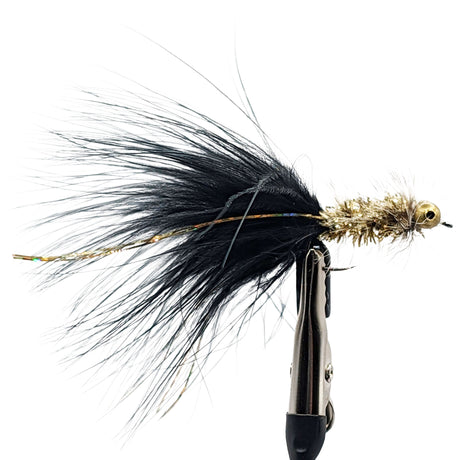 Fishing lure with black and gold details on a white background