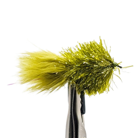 Green fishing lure on a hook against a white background