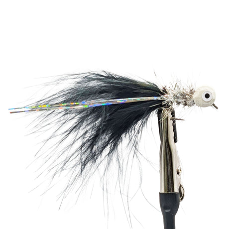 Fishing lure with black feathers and metallic body on a white background