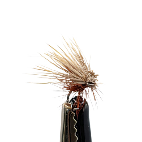 Close-up Elk Hair Caddis dry fly with tan body and elk hair wing