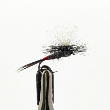 Macro close-up of Iron Blue Dun parachute dry fly with blue grey body and white post