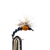 Fly fishing fly on a hook against a white background