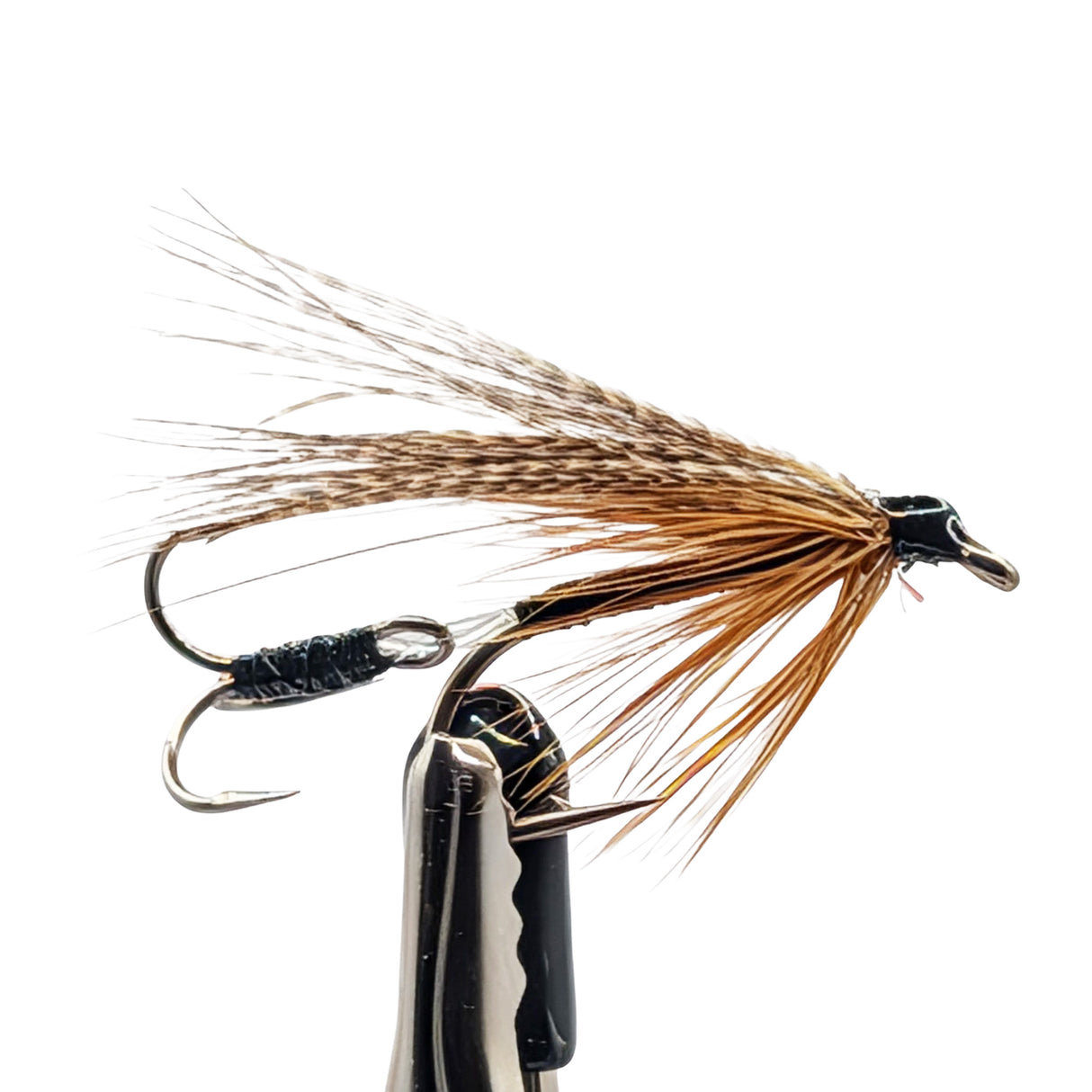 Seat Trout Fishing fly with brown and black details on a white background