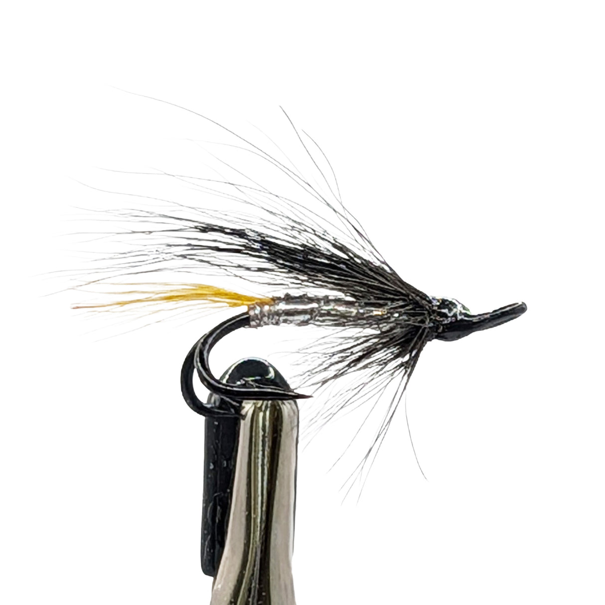 sea trout fly with black and yellow feathers on a white background