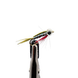 A close-up of a stickleback fishing fly lure. The fly has a metallic silver body with iridescent green-blue striping, a black eye, a gold hook, and red and olive-green hackle wings.